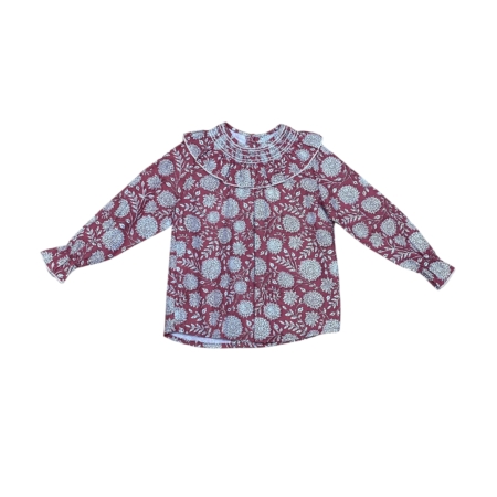 Blusa infantil burdeos 100% algodón con cuello volante.
