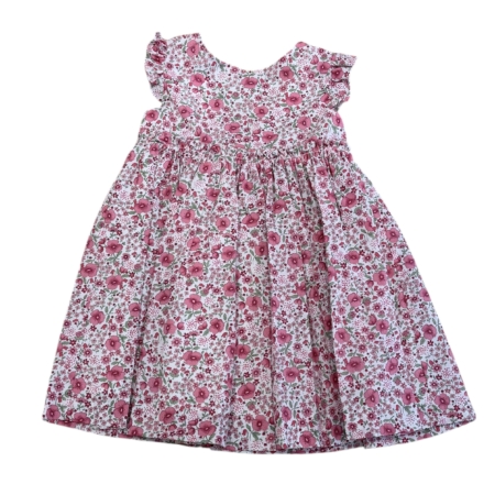 Vestido de niña modelo Amapola con lazos en los hombros, confeccionado en tela Liberty original y algodón orgánico, estampado floral tonos suaves, tallas 3 a 8 años.