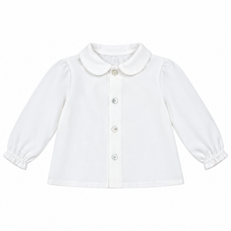 Vista frontal de la blusa unisex Loise blanca para bebé con cuello redondo clásico y elaborada en España.