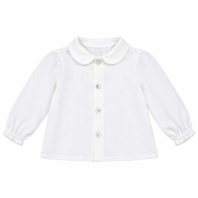 Vista frontal de la blusa unisex Loise blanca para bebé con cuello redondo clásico y elaborada en España.