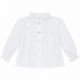 Vista frontal de la blusa Luisa blanca de cuello fruncido para niña con cierre abotonado y elaborada en España.