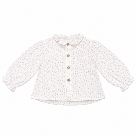 Vista frontal de la blusa nube rosa confeccionada en algodón orgánico de bambula para niñas de 1 a 3 años, con cuello de volantes y estampado delicado.