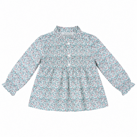 Vista frontal de la blusa infantil Virginia confeccionada en tejido 100% algodón con estampado floral multicolor, cuello alzado, jaretas delanteras y manga larga, producto elaborado en España.