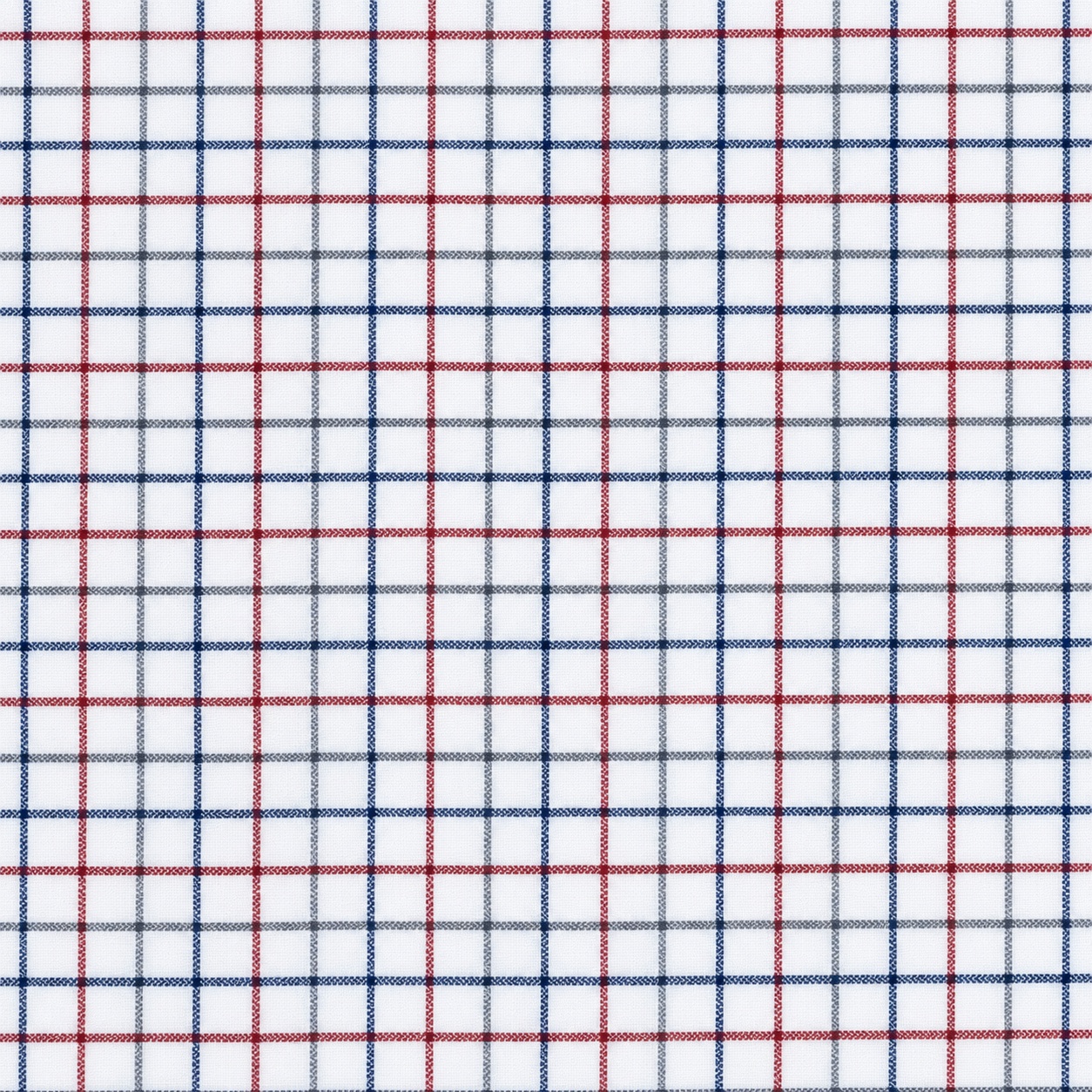 Detalle ampliado de la calidad del tejido de cuadros Windsor 100% algodón natural de la camisa infantil.