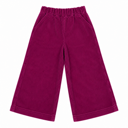 Pantalón de pana infantil color frambuesa de corte ancho y cintura elástica fruncida para niña de 3 a 10 años, producto elaborado en España.